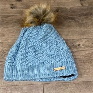 Woman’s blue knit beanie
